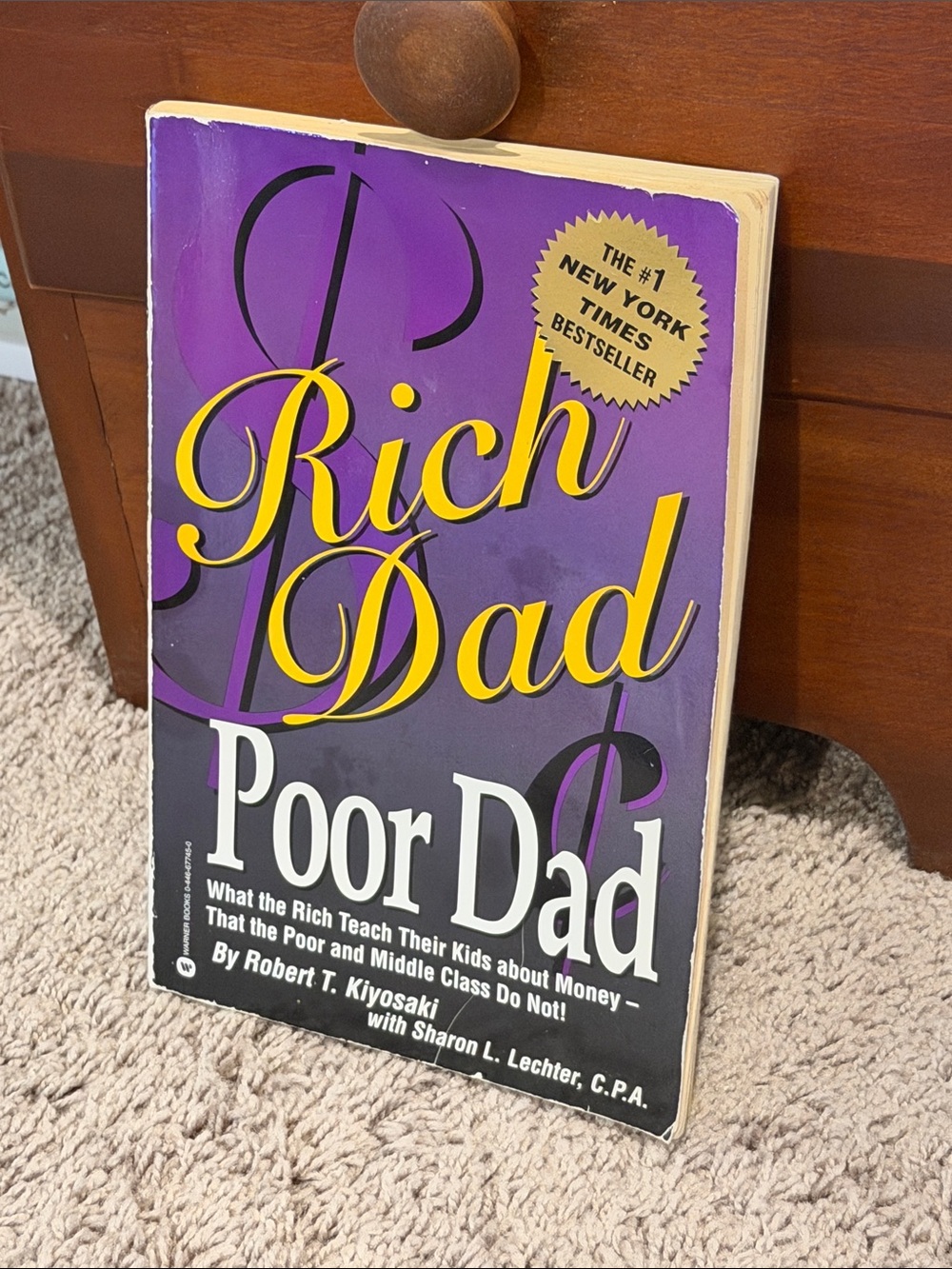 Rich Dad Poor Dad by Robert Kiyosaki - Purple & Yellow Cover